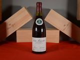 a bottle of wine that is sitting on a table