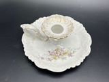 a small cup and saucer sitting on a saucer