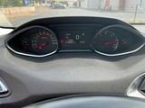 a car dashboard with two speedometers and a steering wheel