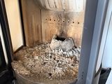 a stove with a pile of rocks inside of it