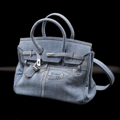 a blue purse that is sitting on a table