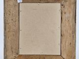 an old wooden easel with a blank piece of paper in it