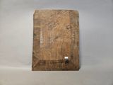a piece of wood that is laying on a table