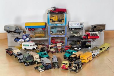a lot of toy trucks that are sitting on the floor