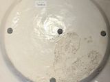 a white plate with a hole in the middle of it