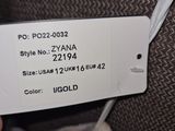 a person holding a white luggage tag on the back of a suitcase