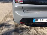 a silver car parked on the side of the road