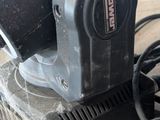 an image of a corded sander on a table