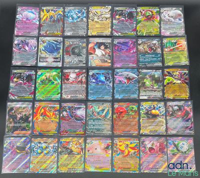 a large collection of pokemon cards sitting on top of a table
