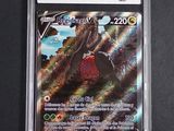 a close up of a card in a plastic case on a table