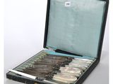 a suitcase with a bunch of knives inside of it