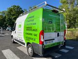 a green van that is parked on the side of the road