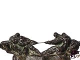 two statues of a man and a woman sitting on top of each other