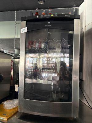 a silver refrigerator with a glass door inside of it