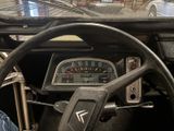 steering wheel of a car with a speedometer and gauges
