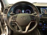 the interior of a car with a steering wheel and dashboard controls