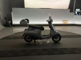 a scooter that is parked in a garage