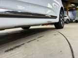 a white car that is parked in a garage