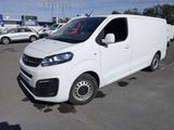 the white van is parked in a parking lot with other cars