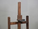 a wooden easel with a book on top of it