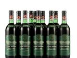 six bottles of wine sitting next to each other on a white surface