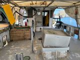 a boat that has a sink in the middle of it