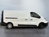 the white van is parked on the concrete floor in the room
