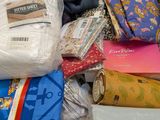 many different types of fabric in a box together