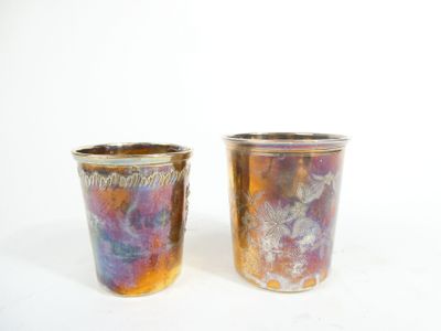 two cups that are next to each other on a table