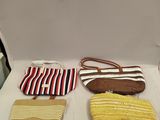 three purses sitting on a table with a white table cloth