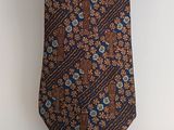 an image of a tie hanging on a wall with a white background