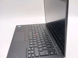 a laptop with a black keyboard on a white surface