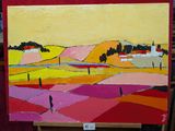 un tableau posé sur un chevalet représentant un paysage