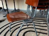 a chair that is sitting on a rug in front of a table