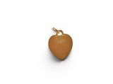 a close up of a heart shaped pendant on a white surface