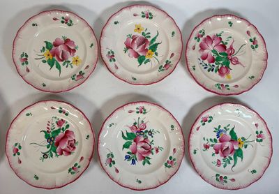 six plates with pink flowers and green leaves on them