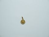 a close up of a gold coin on a white surface
