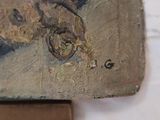 a close up of a painting of a horse on a piece of wood