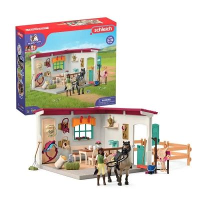 the playmobil is in the box with the horse and carriage