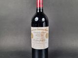 a bottle of wine that is sitting on a table