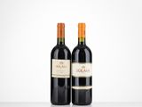 two bottles of red wine sitting on top of a table
