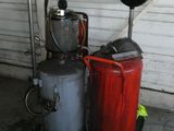 two buckets and a canister in a garage