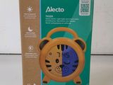 a close up of a box with a clock inside of it