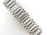 a close up of a watch bracelet on a white surface