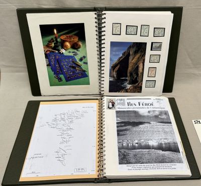 an open book sitting on top of a table covered in pictures