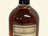a bottle of whiskey that is sitting on a table