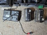 two tools that are sitting on the floor next to each other