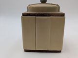 a coffee grinder sitting on top of a white table
