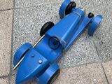 a toy car that is laying on the ground