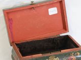 a small wooden box that has a lock on it